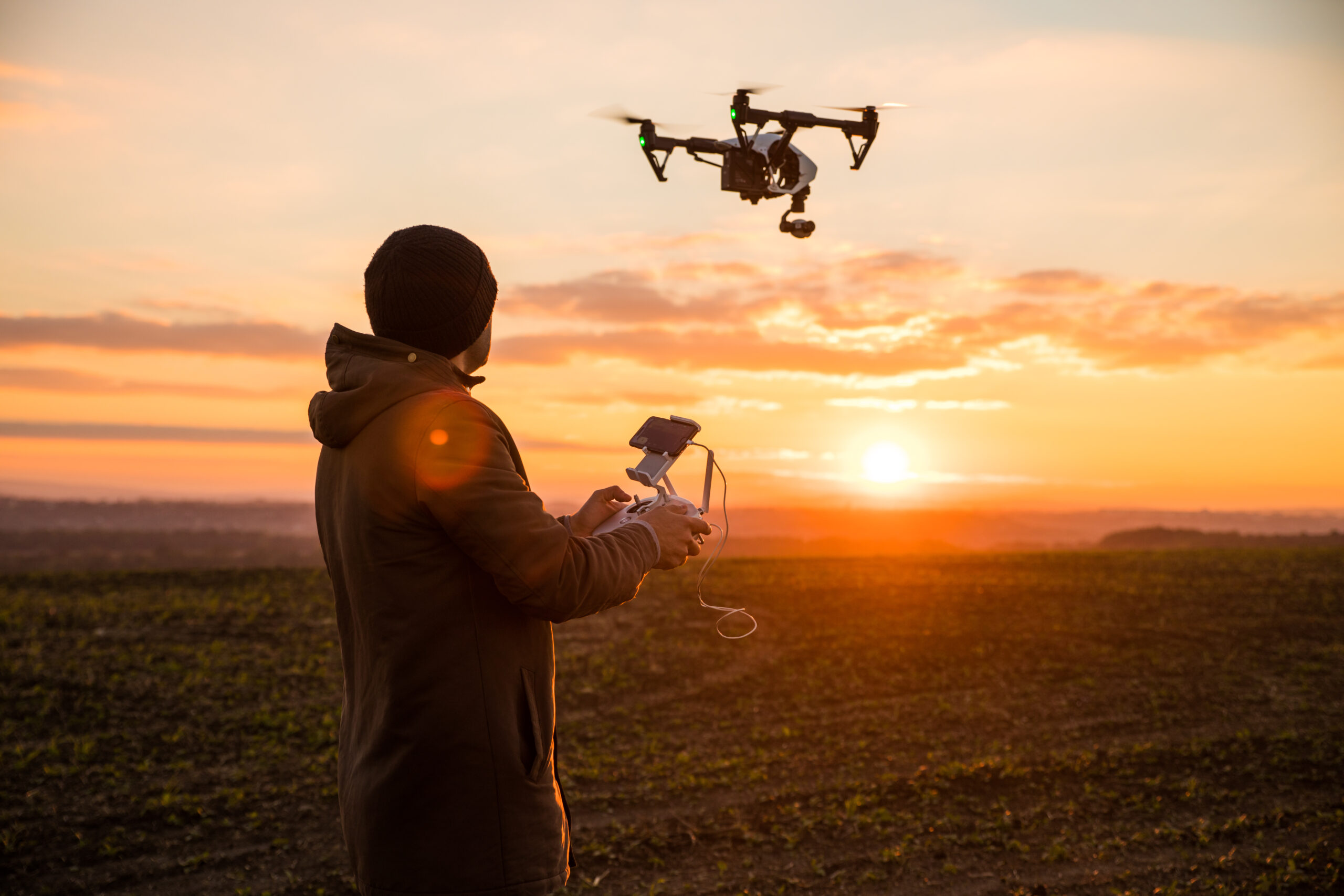 Man operating a drone;